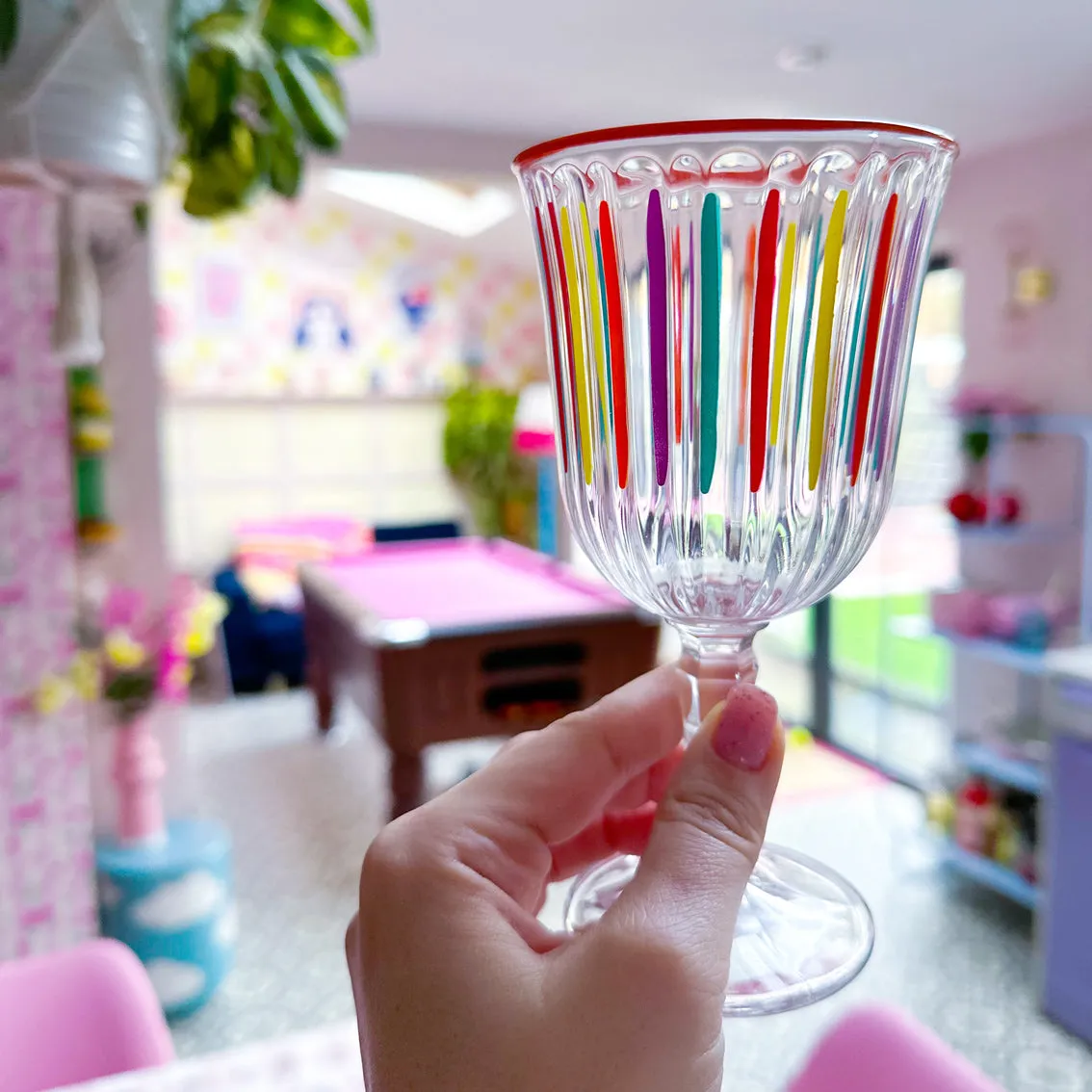 Bright striped multi coloured wine glass